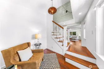 Bonus space on the other side of the stairs makes a great playroom, office or add shelves up the vaulted ceiling and have your own mini library!