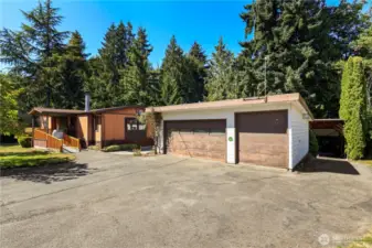 3 car detached garage with 2 heat sources and 110, 220 amps.