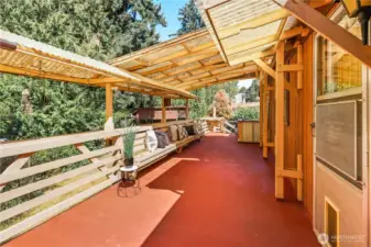 Huge deck partially covered plus awning.