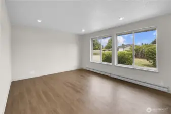 Large living room windows let in loads of natural light!