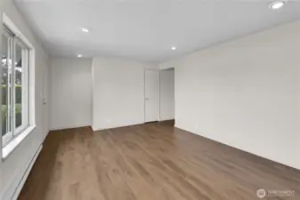 Living room opening from entry to hallway