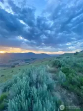 Endless Horizon-From the cabin’s vantage point, the land stretches wide—rolling hills and valleys converge in a panoramic dream. Breathe deeply and dream bigger here