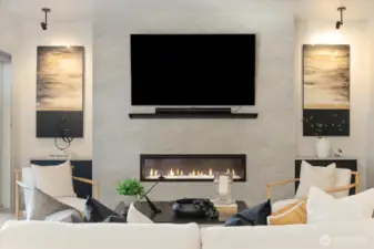 72” Crave linear fireplace with tile surround, custom metal mantle and Built-in cabinets in this well appointed living room