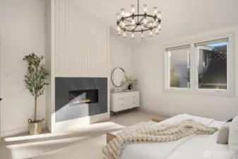 Built in and tile surround fireplace with detailed woodwork for elegant accents in Primary suite