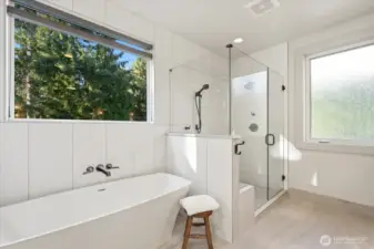 Double headed shower, stand alone soaker tub, radiant in floor heating in Primary Bath