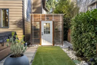 Backyard Jacuzzi to your left, Greenhouse straight ahead. Both stay with the home.