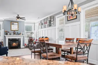view looking from the kitchen island to the eating space and family room