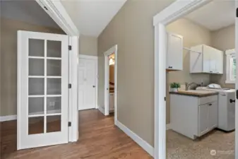 FRENCH DOORS | Main level office to the left, Garage, Half bath and Laundry Room with STORAGE!