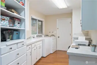 Such a great Laundry area; so much storage, and even a little work area!