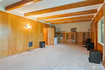 You'll love those beams and built-ins .... (and large storage room right out that open door)