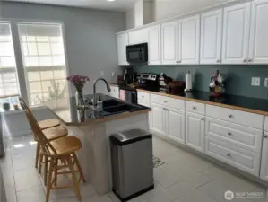 Kitchen entry to left of living room.