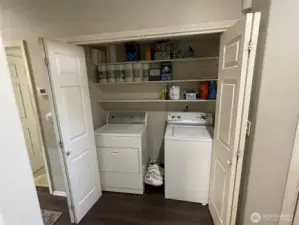 Laundry room with extra storage.
