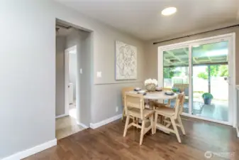 Dining room off of the kitchen and sliding glass door leads to the fully covered patio and fully fenced back yard..