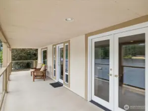 Primary Bedroom has French Doors leading out to large Deck with great Lake view!