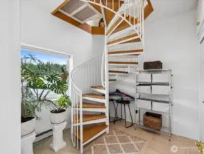 Spiral staircase also leads to lowest Level - with Great Room & Foyer with wall of Closets for extra Storage.