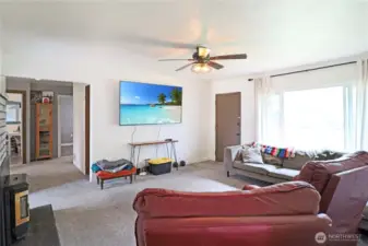 Warm and inviting living room featuring a cozy wood-burning insert—perfect for chilly  evenings.