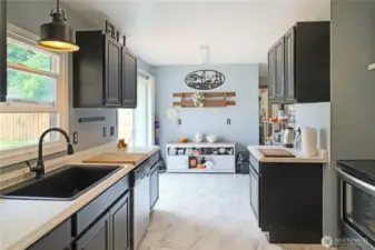 Updated kitchen with new stainless-steel refrigerator and sleek modern finishes—ready  for your next culinary adventure.