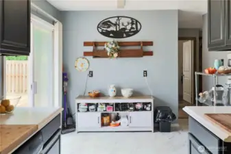 Light-filled breakfast nook connects the kitchen to the new deck—ideal for morning  coffee or casual meals.