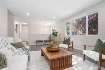 Kitchen behind wall to left, owner's suite down hall