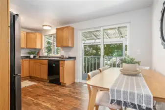 Kitchen features ample cabinet space including pantry cabinet. Nice matching black appliances
