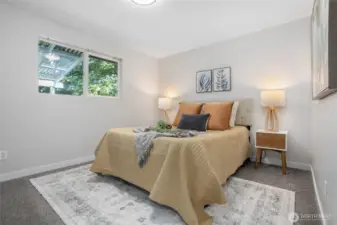 Owner's suite on upper floor shares access to full bath