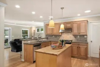 Kitchen connected to informal living and covered deck