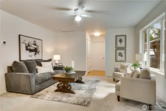 Bright and welcoming—main floor living and family rooms flow seamlessly from the kitchen to the private backyard.