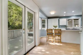 Indoor-outdoor living at its best with French doors opening to a deck, gazebo, and spa-worthy hot tub.