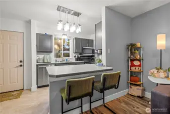 The peninsula island includes space for two seats, making it easy to serve guests and create a comfortable spot for entertaining while staying connected to the main living area.