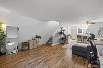The open-concept layout allows you to design the space however you’d like. Thanks to large windows throughout this corner unit, natural light fills the home, creating a bright and versatile setting.