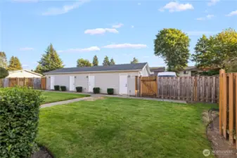 Enjoy an outdoor green space just beyond the home, offering plenty of room to relax or host guests. It extends the entertaining possibilities beyond the interior.