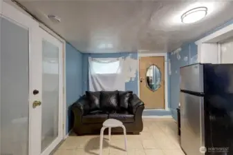 This room needs some paint but it is downstairs in the basement and could be used as a studio.