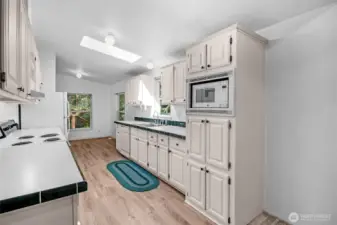 Spacious kitchen with new LVP flooring.