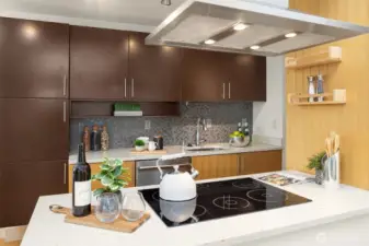 Another view of the sleek kitchen.