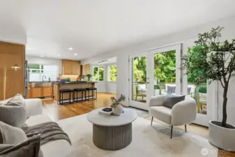 Family room, kitchen and deck off the back to green space and mountain views
