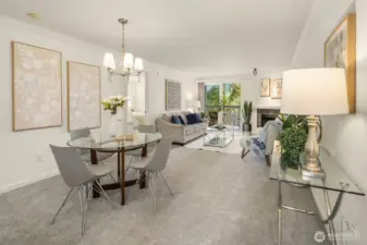 As you enter the condo, you’re welcomed by brand-new carpet and an open layout connecting the dining area and living room