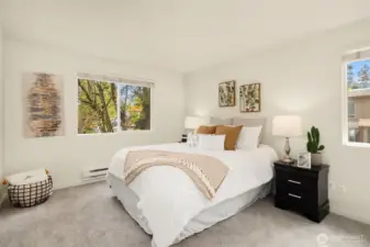 Second bedroom featuring a bright corner layout with two generously sized windows and new carpet