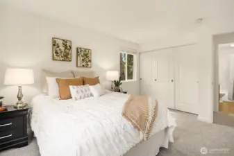 Another look at the second bedroom, highlighting the spacious three-panel closet.