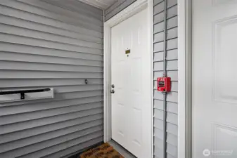 Entry to Unit B-209, at the tidy and welcoming second-floor