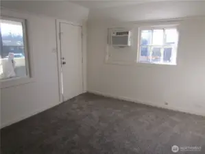 Living room with new carpet.