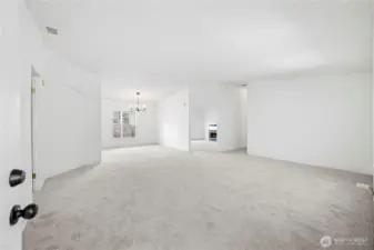 Come on in! Big living room is open to the dining room and den, too.