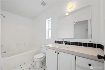 Primary bathroom has good counter space and the full tub and shower for greatest flexibility.