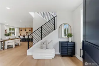 Large inviting entry provides open views to the great room and classy metal railing