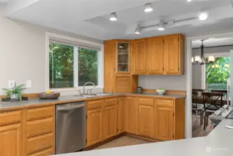 The kitchen lovingly connects to the formal dining room. Stainless steel appliances are offered.