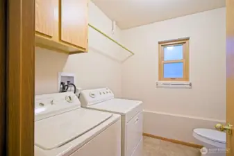 Laundry room on the lower level.  Washer and dryer stay!