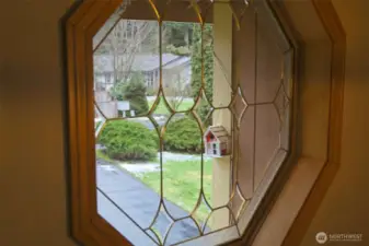 Beautiful decorative window in the entryway.