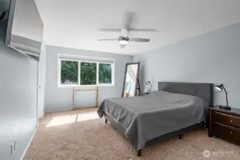 Primary bedroom with bathroom and walk in closet