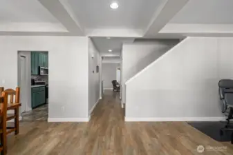 Upon entering the front door, newer LVP flooring in living room, family room, dining room and stairway