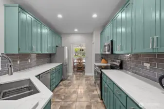 New quartz countertops, granite composite sink, garbage disposal and tile backsplash