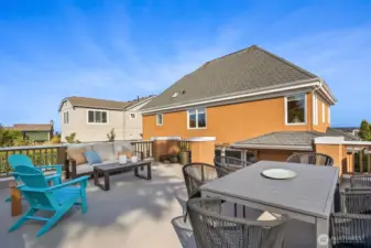 This awesome deck is on top of the 2-car garage with EV Charger, which is accessed by the quiet neighborhood alley in back.